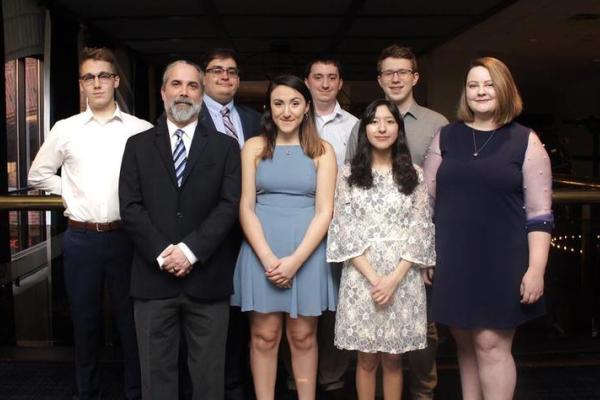 (Front row, left to right): Dave Arnett (coach), Jacinda Rivas, Maria Sanchez and Genevieve Hackman. (Back row, left to right): Dan Bannister, Amar Adam (coach), Lincoln Garrett (coach) and Anthony Trufanov. Photo provided by the NDT.