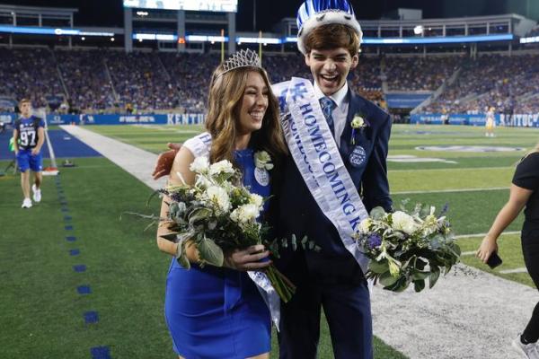 UK Homecoming Queen Claire Dzan and Homecoming King Preston White celebrate at UK football game