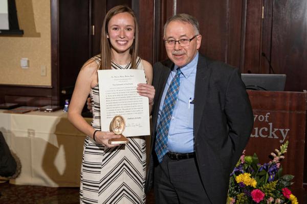 The Algernon Sydney Sullivan Award was presented to Madison Conroy by Sullivan Committee member Larry Grabau during the University Honors and Recognition Awards Program April 11, 2018.