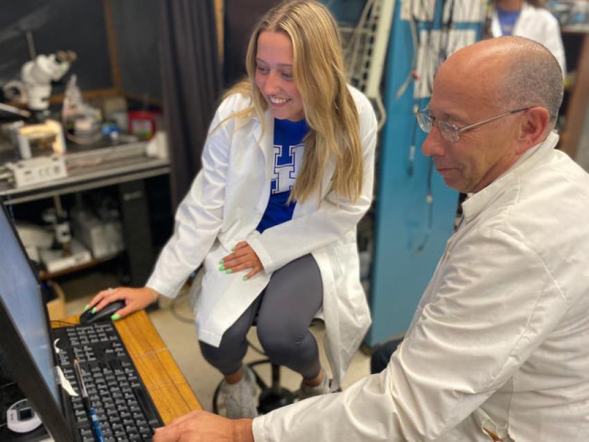 UK student Kaitlyn Brock, left, and Professor Robin Cooper work together in a research lab.